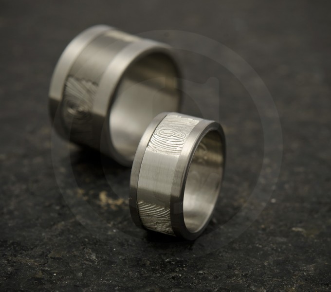 Wedding rings with fingerprints on the outside